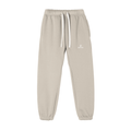 Beige sweatpants with a brand logo on a white background